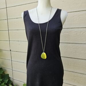 long silver tone chain necklace with large yellow cats eye pendant